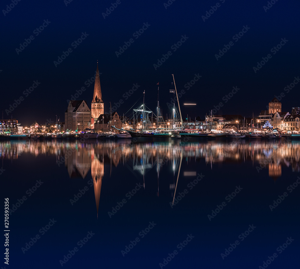 Rostock night panoramic. Warnow canal with ships and Baltic Sea in Rostock Germany in Hanse Sail Festive