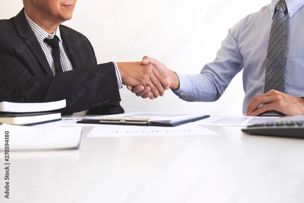 Real estate agent and customers shaking hands together celebrating finished contract after about home insurance and investment loan, handshake and successful deal Real estate agent and customers shaking hands together celebrating finished contract after about home insurance and investment loan, handshake and successful deal