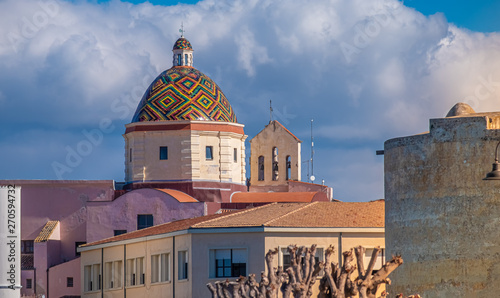 Fototapeta Naklejka Na Ścianę i Meble -  Majolica tiled cupola of Jesuit church of San Michele, Alghero (L'Alguer), Sardinia, Italy.  Famous for the beauty of its coast and beaches and its historical city center.