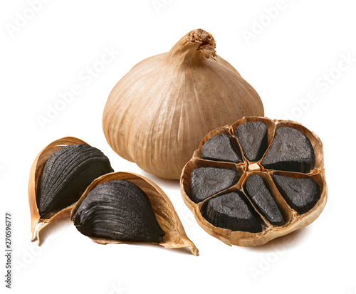 Tableau sur toile Tasty black garlic isolated on white background