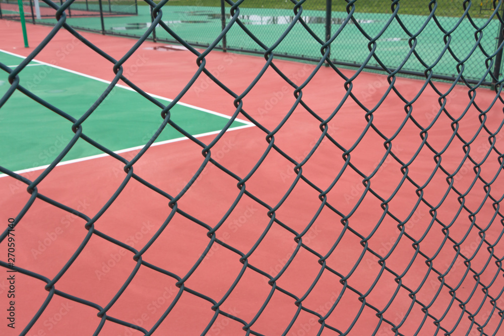 Fototapeta premium Wire guardrail for outdoor plastic basketball court
