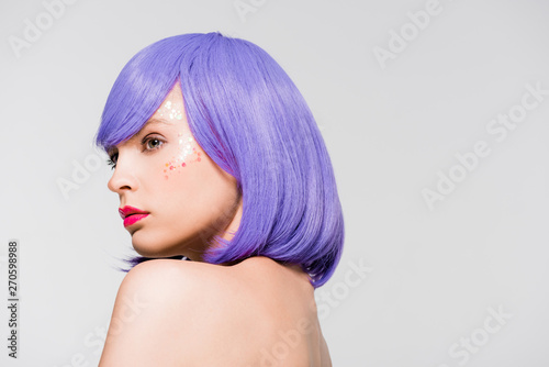 pretty naked girl in purple wig isolated on grey
