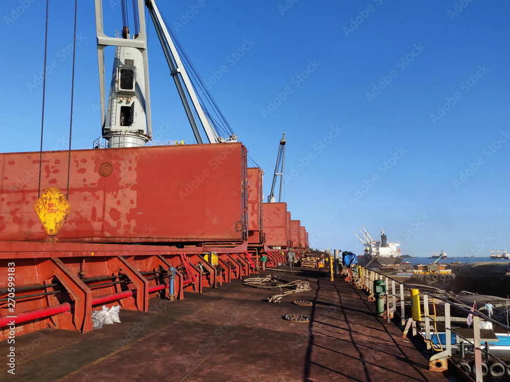 Discharging or loading operation on bulk ship.