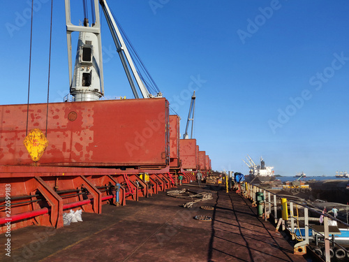 Discharging or loading operation on bulk ship.
