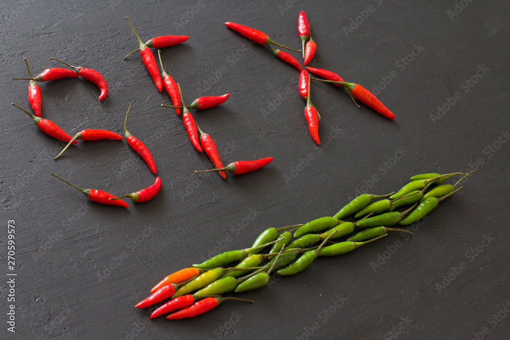 Word Sex Red Hot Chili Peppers On Black Background On Black Table Swx Letter Arranged From Red