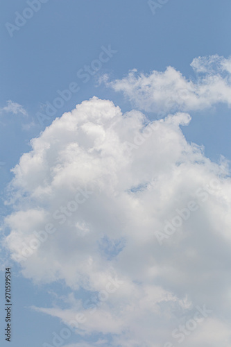 Fototapeta Naklejka Na Ścianę i Meble -  White fluffy clouds in the blue sky background.