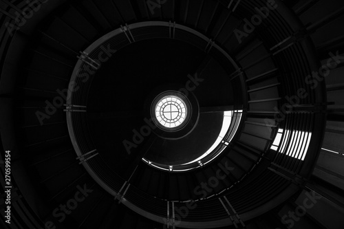 Abstract Geometric Architecture Background. Spiral Staircase in Abandoned Silo.
