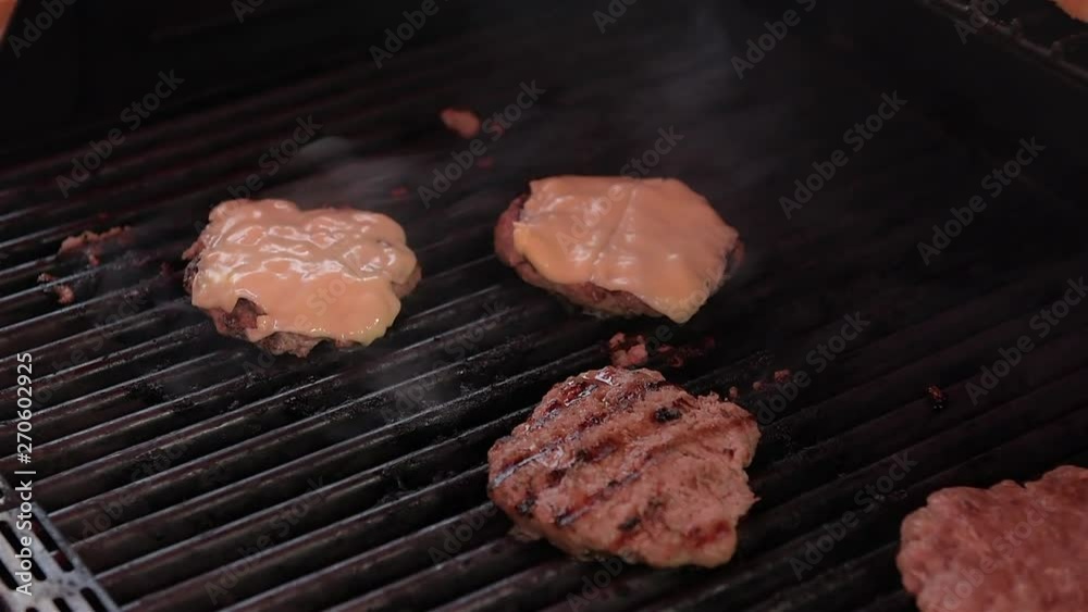 Fried meat for burger on BBQ. Fried meat for burger on BBQ.