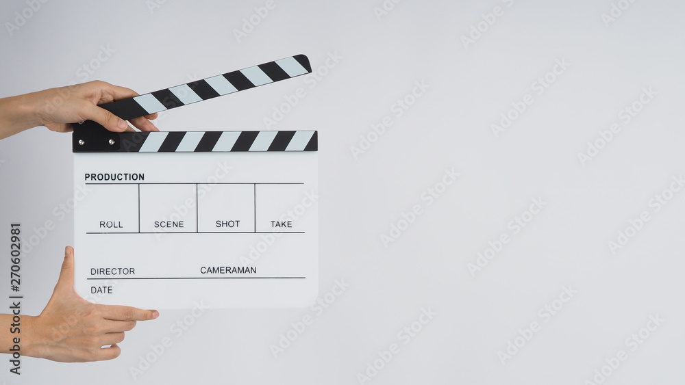Hands is holding  Clapperboard or movie slate. it use in video production ,film, cinema industry on white background.