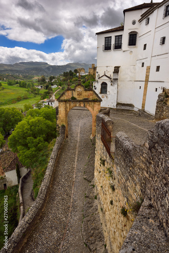 Arch of Felipe V with old stone path entrance to the city of Ronda Spain photo