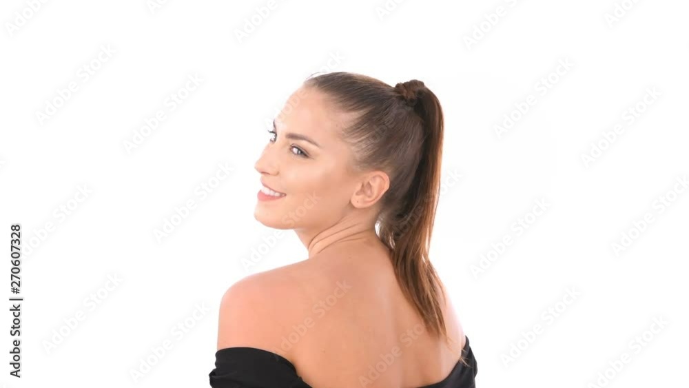 Beauty concept. Beautiful woman turned back on a white background Beauty concept. Beautiful woman turned back on a white background