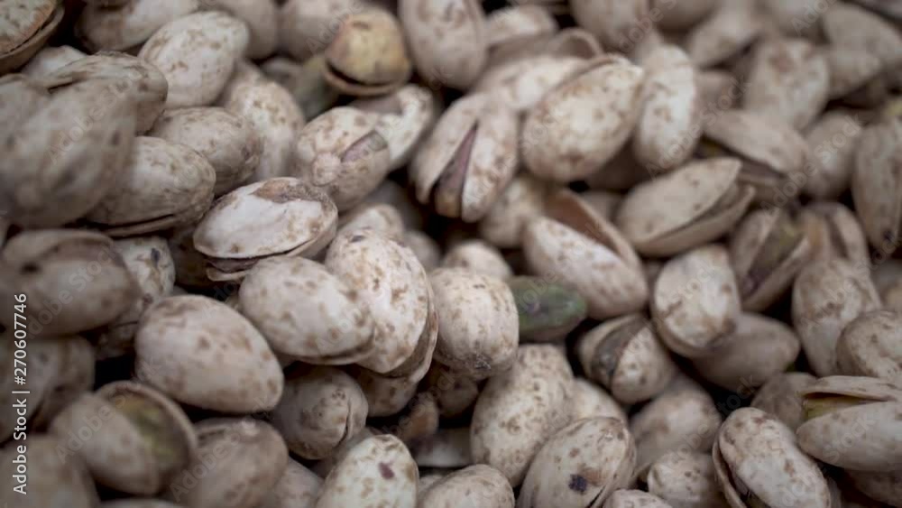 Roasted pistachios in shell piled in bulk, Close Up Overhead Gib Shot Roasted pistachios in shell piled in bulk, Close Up Overhead Gib Shot