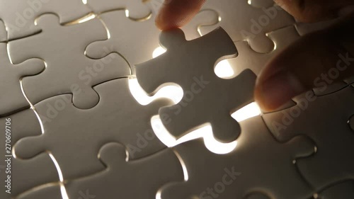 Piece of white jigsaw filling by hand, Success concept