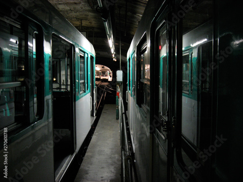 A photo of metro trains standing in a tunnel.