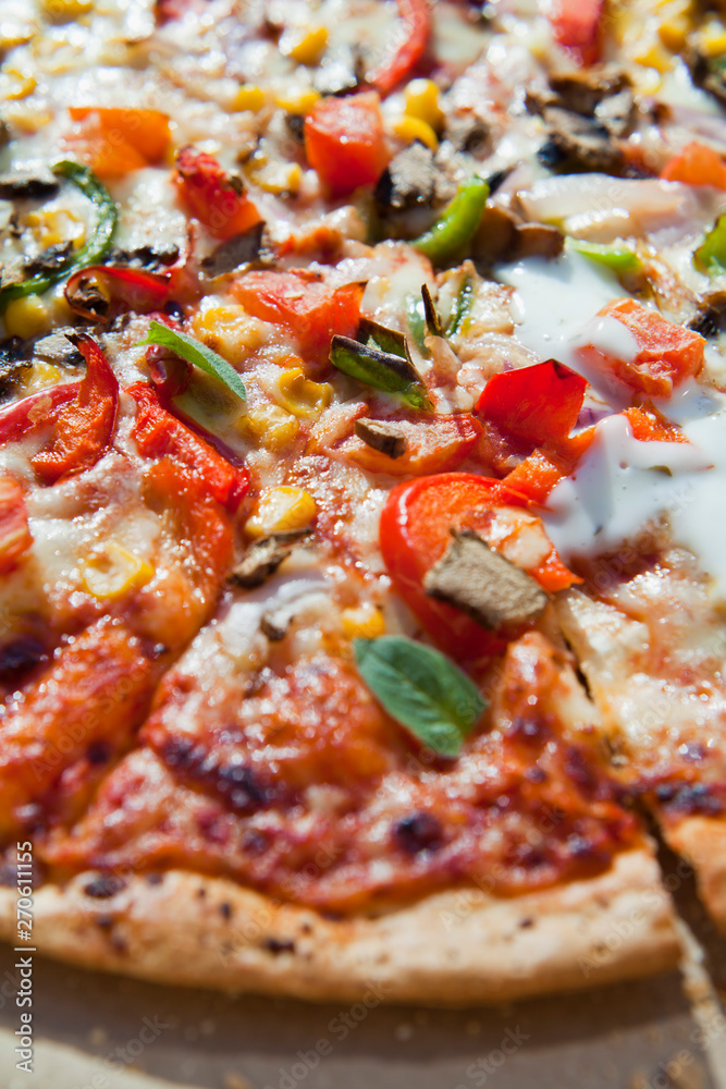 Takeway pizza in the cardboard boxes -  delicious slices ready to enjoy in the sun.