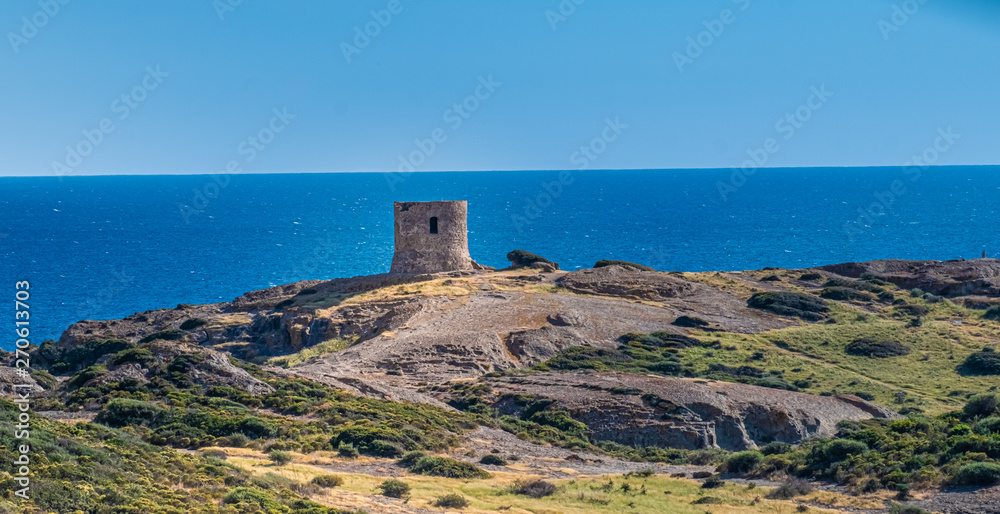 Catalan defense tower along the spectacular coastal road between Alghero and Bossa (SP 105), Sardinia, Italy. One of the most panoramic spots in Italy.