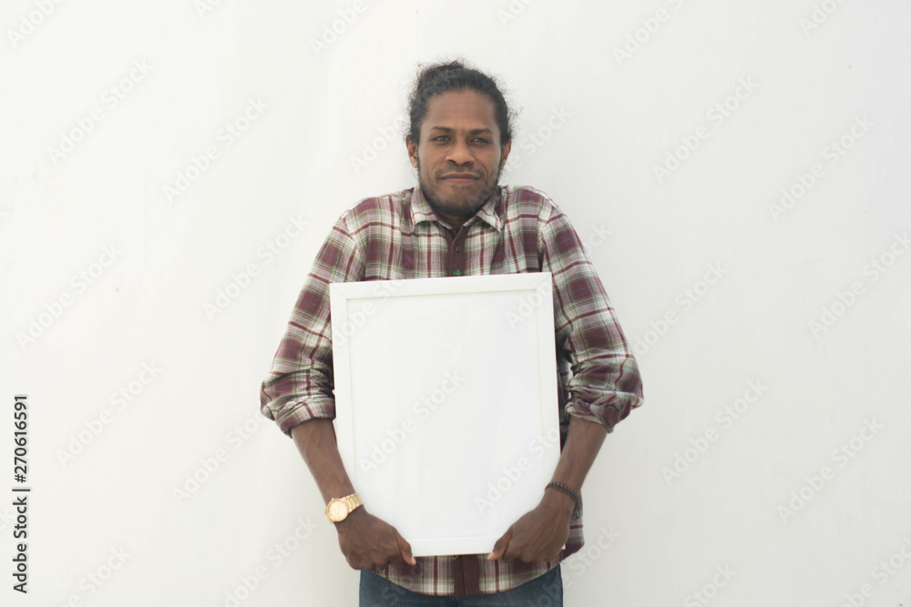 young black man holding white board with isolated background in white young black man holding white board with isolated background in white