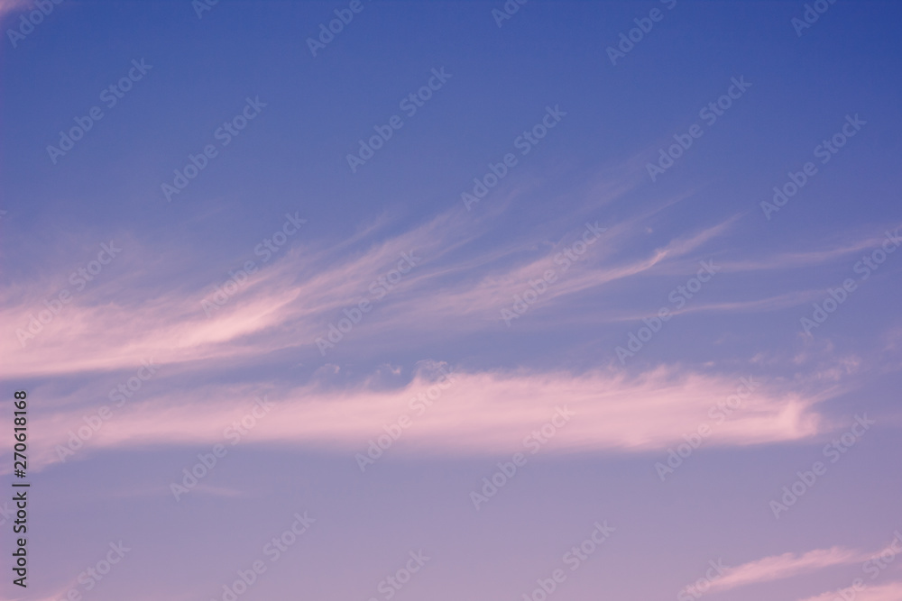 calming idyllic evening soft colors blue sky and slightly pink clouds natural background