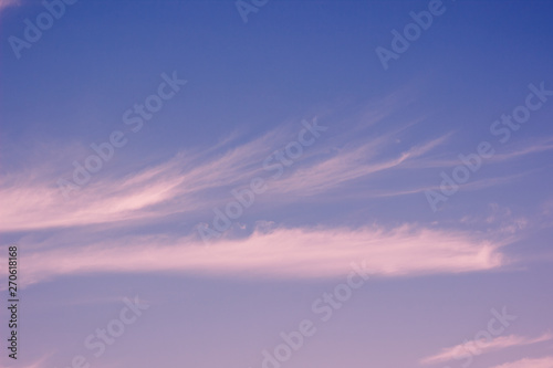 calming idyllic evening soft colors blue sky and slightly pink clouds natural background