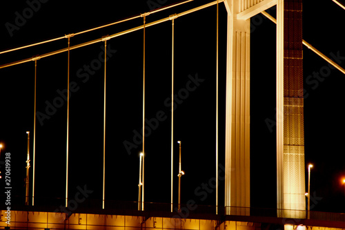 Budapest Hungary, 05.29.2019 glowing Erzhebet bridge across the Danube River. night Budapest glowing in gold