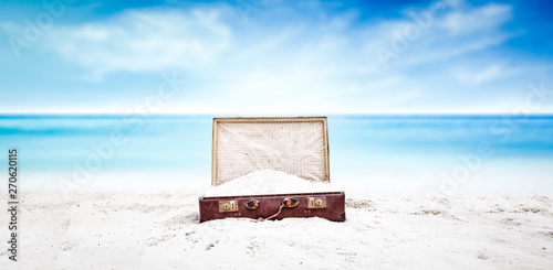 Summer suitcase of sand and beach 