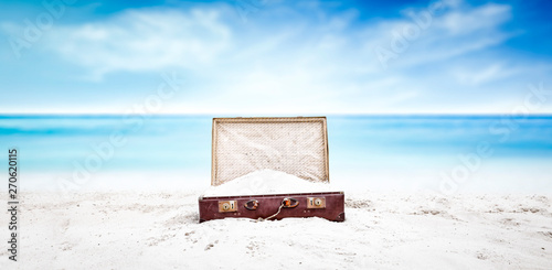 Summer suitcase of sand and...