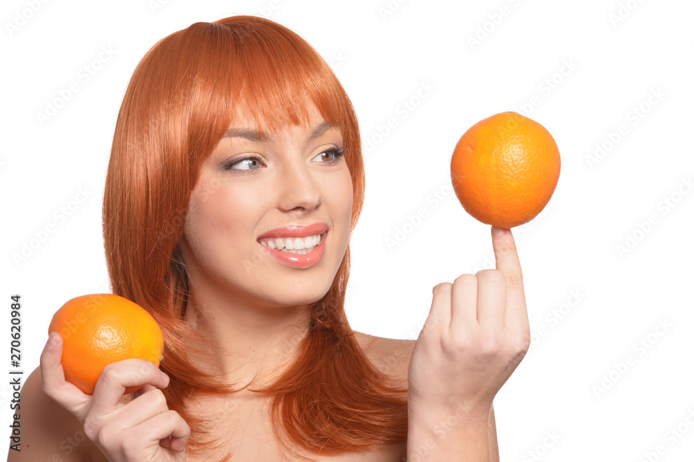 Portrait of young woman posing with oranges on white background Portrait of young woman posing with oranges on white background