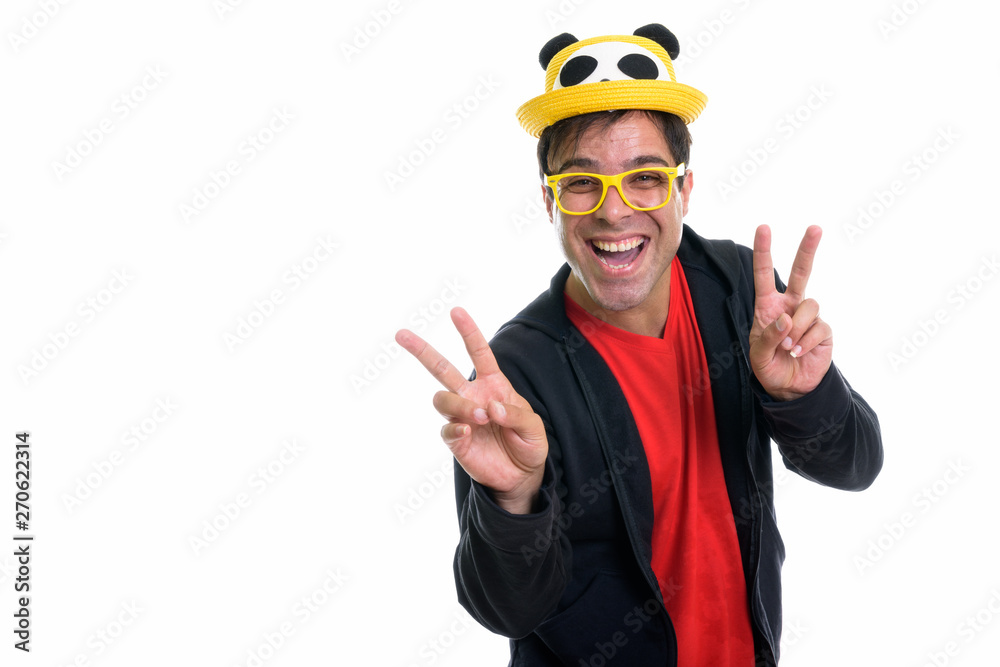 Happy Persian man smiling and making peace sign Happy Persian man smiling and making peace sign