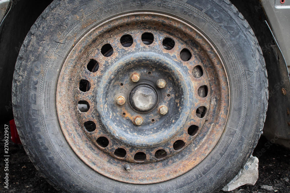 old car rusty wheel rim