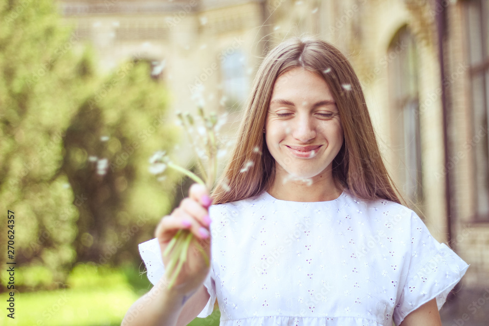 happy, joyful girl with dandelion.positive emotions, summer walk in the park