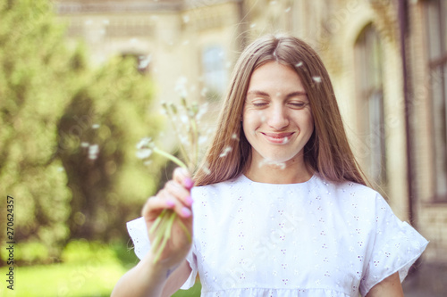 happy  joyful girl with dandelion.positive emotions  summer walk in the park