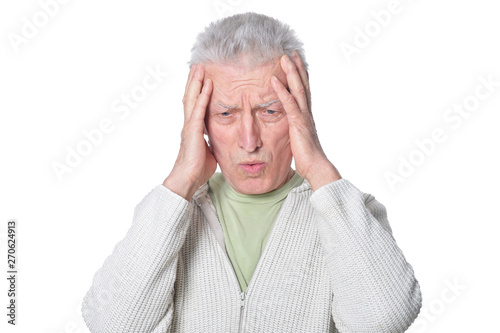 Portrait of senior man posing on white background