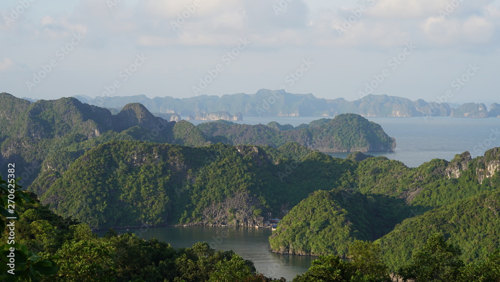 Beautiful landscape with rocks in sea, Cat Ba Island in Vietnam. View from the Cannon Fort before sunset.