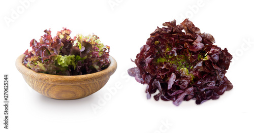 Lettuce leaves in wooden bowl. Top view. Lettuce isolated on a white background. Red lettuce with copy space for text.