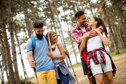Group of four friends hikin...