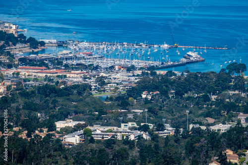 Scenic panoramic view of Monterey, California, with the Harbor and Marina, including the breakwater, Fisherman's Wharf and the Municipal Wharf below, as viewed from Jack's Peak.