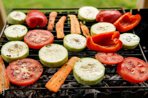 Grill party in a garden. Healthy food preparing outdoors on summer or spring picnic.