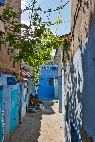one of the traditional narrow streets of the tourist city of chaouen, in northern Morocco © juanorihuela
