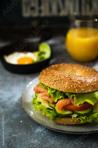 Breakfast bagel with salmon and lettuce