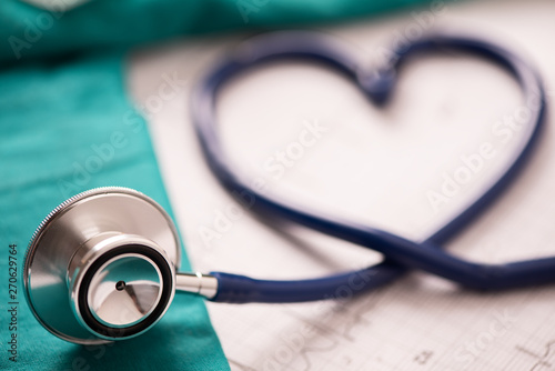 Medical stethoscope twisted in heart shape.
