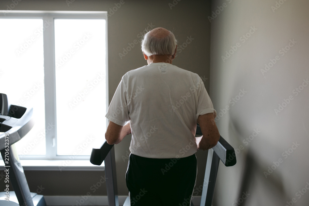 Old man on treadmill Old man on treadmill