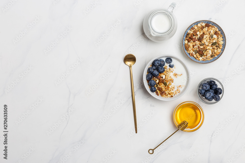 Free space cereal with oat, milk, blueberries and honey flat lay Free space cereal with oat, milk, blueberries and honey flat lay