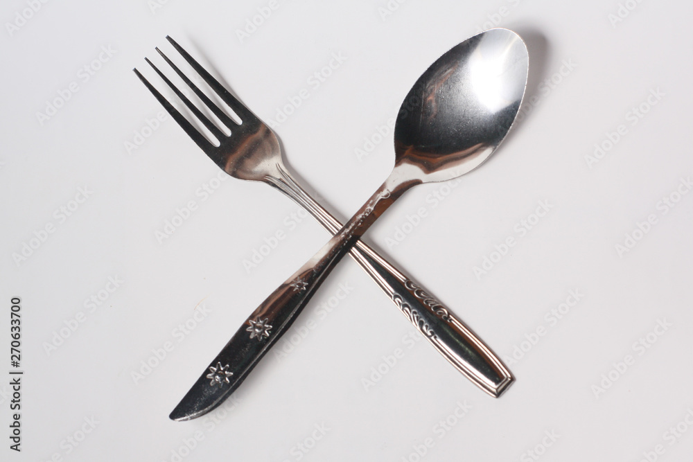 Cutlery , spoon and fork on white background Cutlery , spoon and fork on white background