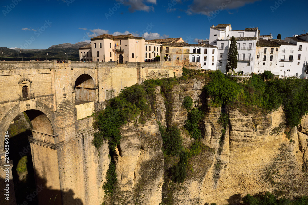 Cliff at El Tajo Canyon on the Guadalevin river with 18th century new bridge at Ronda Spain