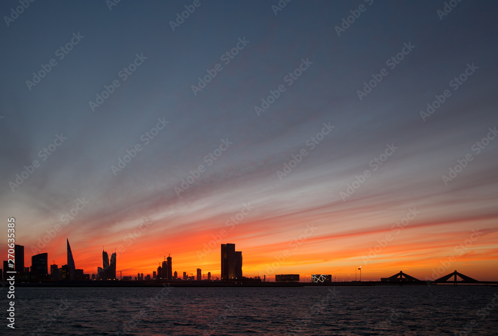 Naklejka premium Bahrain skyline during sunset