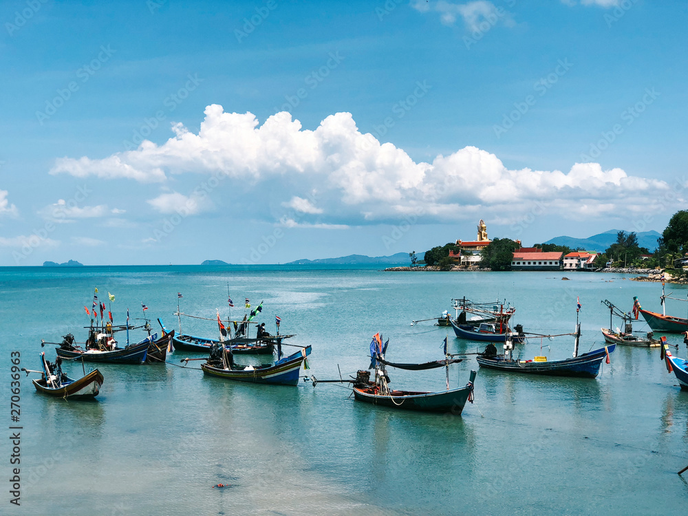 Traditional Thai Fishing Boats in Blue Gulf of Siam Bay Traditional Thai Fishing Boats in Blue Gulf of Siam Bay