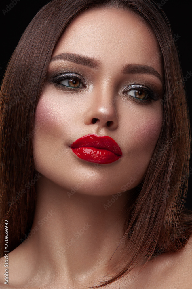 Beauty portrait of model with natural make-up. Fashion shiny highlighter on skin, sexy gloss lips make-up Beauty portrait of model with natural make-up. Fashion shiny highlighter on skin, sexy gloss lips make-up