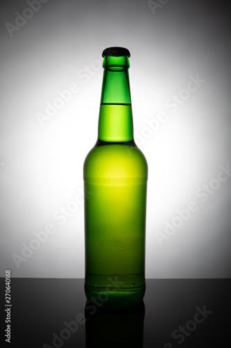 Green bottle of beer isolated on white background