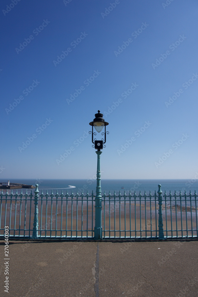 Lampost and railings in Scarborough, UK on a clear blue sky sunny day