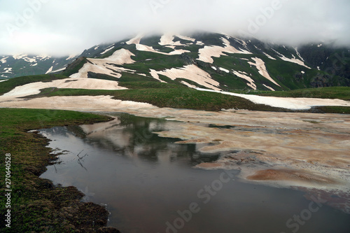 Views of the alpine lake Coruldi where summer does not melt the snow  in the region of Upper Svaneti  Georgia